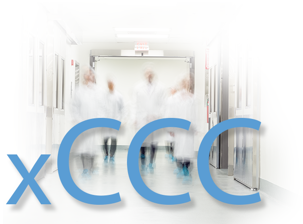 Image containing the letters xCCC superimposed over blurry people wearing lab coats.